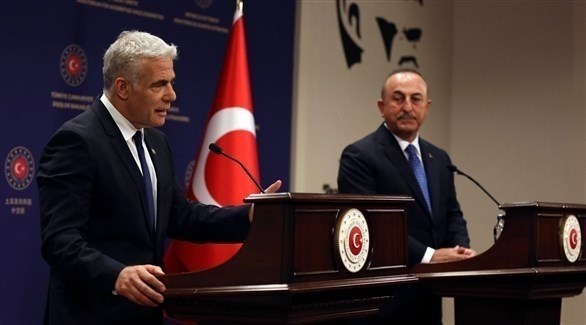 رئيس الوزراء الإسرائيلي ووزير الخارجية التركي (أرشيف)