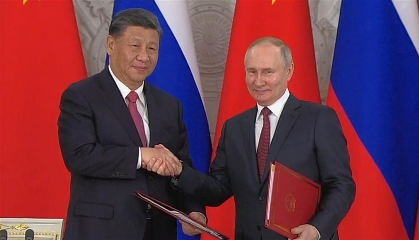 الرئيس الروسي فلاديمير بوتين ونظيره الصيني شي جين بينغ (وكالات)