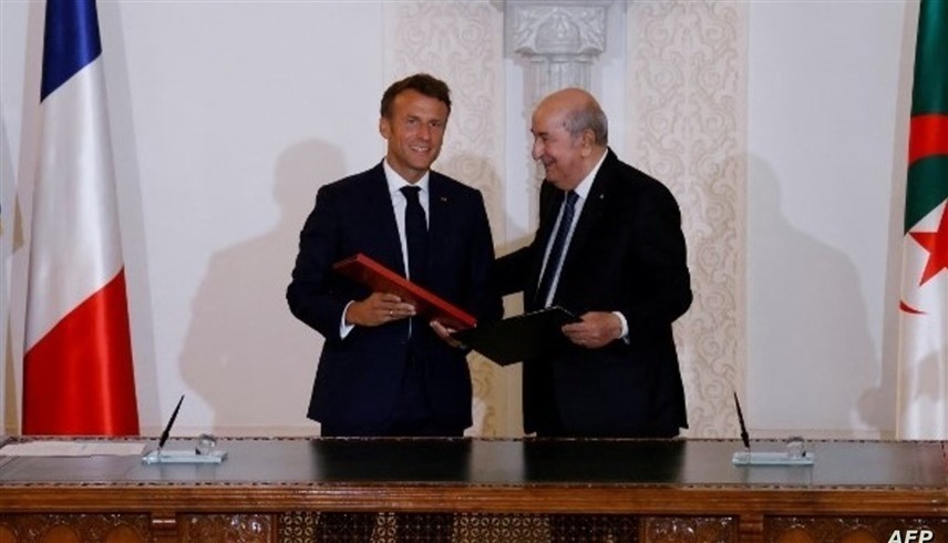 الرئيس الجزائري عبدالمجيد تبون والفرنسي إيمانويل ماكرون (أ ف ب)