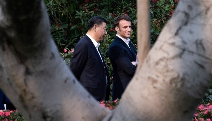 الرئيسان الفرنسي إيمانويل ماكرون والصيني شي جين بينغ (ا ف ب)