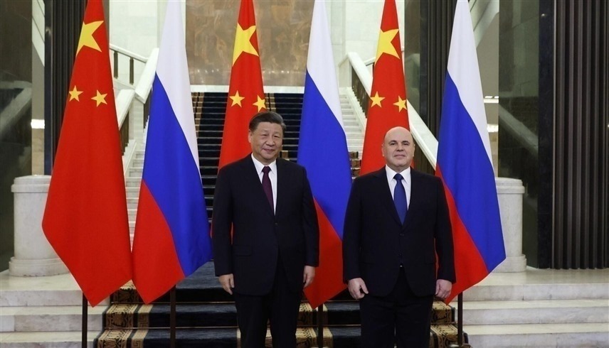 رئيس الوزراء الروسي ميخائيل ميشوستين والرئيس الصيني شي جين بينغ (أرشيف)