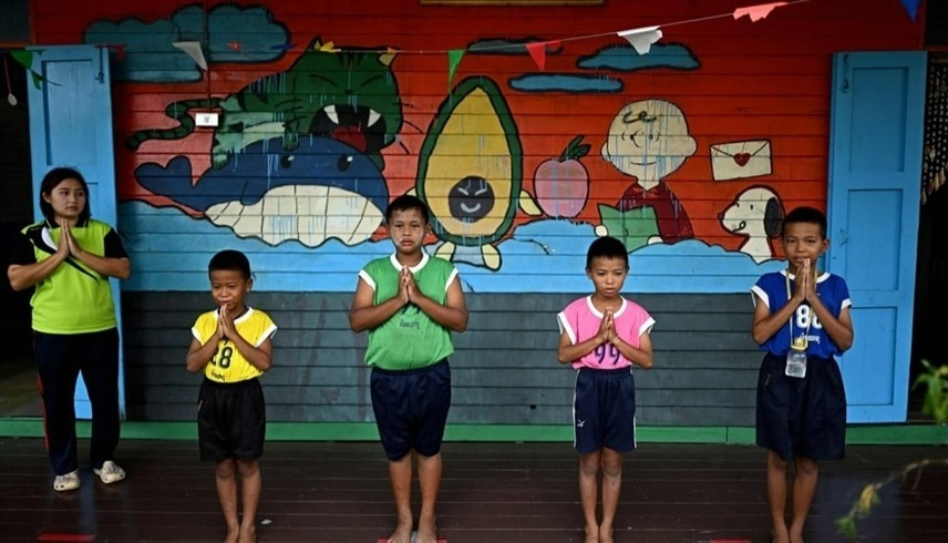 أربعة أطفال حفاة لتأدية النشيد الوطني التايلندي (أرشيف)